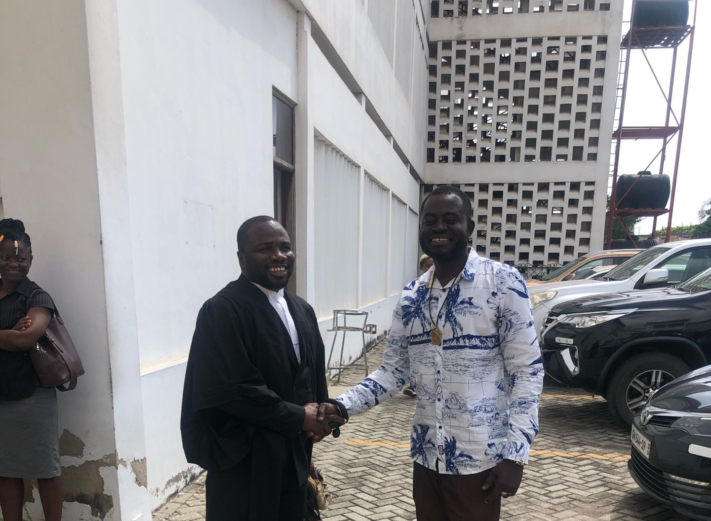 Nana Kwesi Osei Bonsu with legal counsel outside the High Court, Kumasi, Ghana.